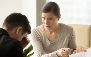 unhappy woman talking to a man