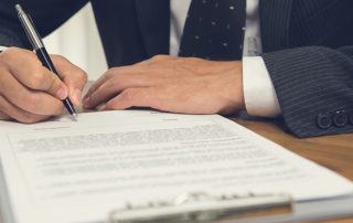 Businessman signing legal business contract agreement