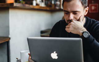 man on a macbook