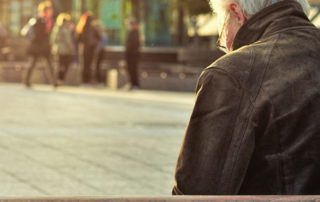 old man sitting on bench