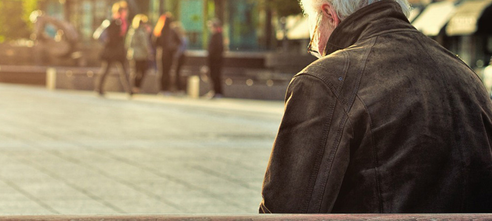 old man sitting on bench