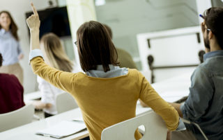 students raising their hand